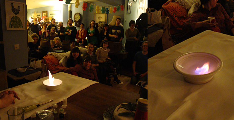 The audience is transfixed by the effect of Copper Nitrate and Bio-Ethanol on the left, and the purple flame of Lithium Chloride and Bio-Ethanol on the right.