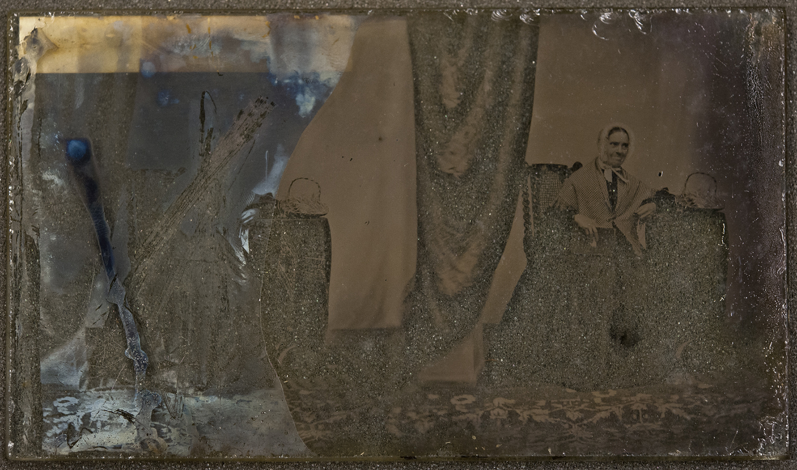 Pair of portraits, an elderly woman [PHtempSB1-5]. Unvarnished half of plate shows tarnishing, and extensive, intentional scratching. 