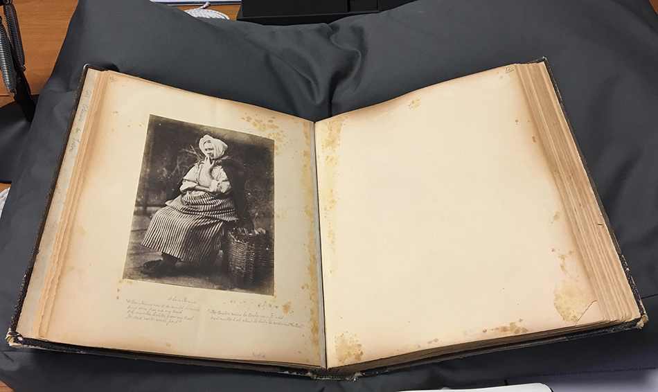 Photograph album with image of a woman