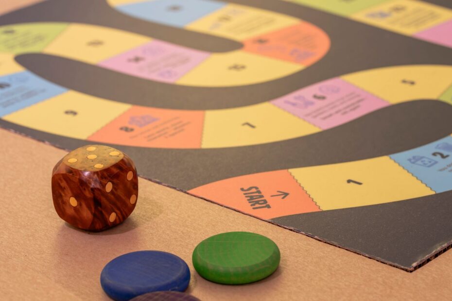 Board game and dice on a cardboard table