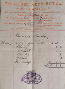 Image of receipt with printed and handwritten text. Some text is in orange ink.