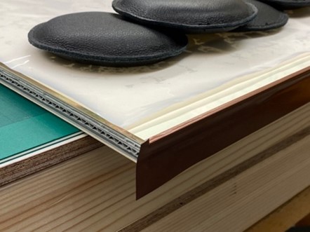 Colour image of boards with copper tape on one side