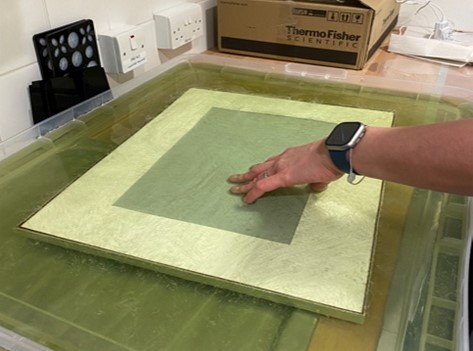 Colour image of frame being submerged in water